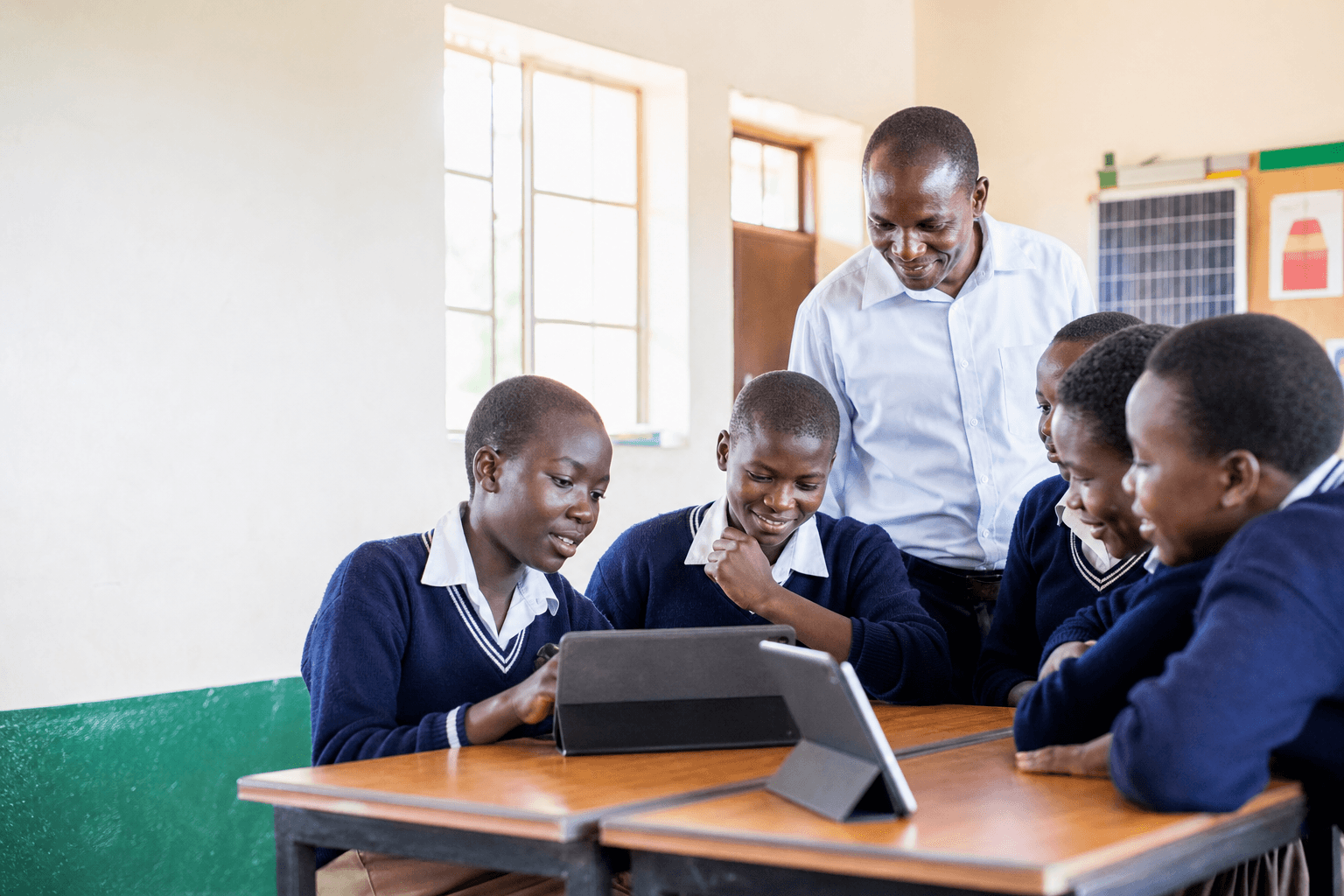 Students and teacher learning together in a Ugandan classroom