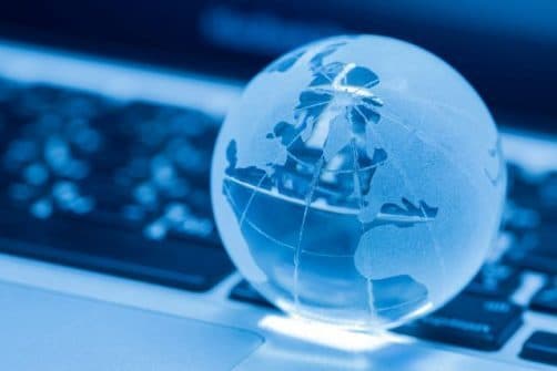 Glass globe resting on a laptop keyboard