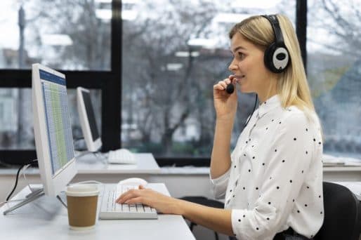 Customer service professional taking an over-the-phone interpretation call on a headset