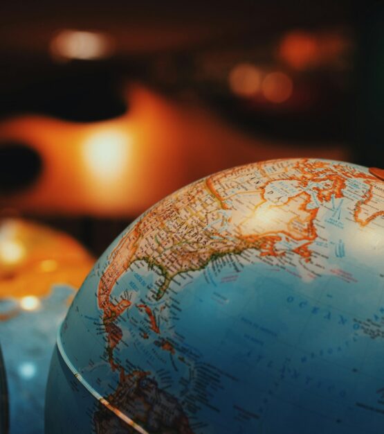 selective focus photo of terrestrial desk globe {{brizy_dc_image_alt imageSrc=