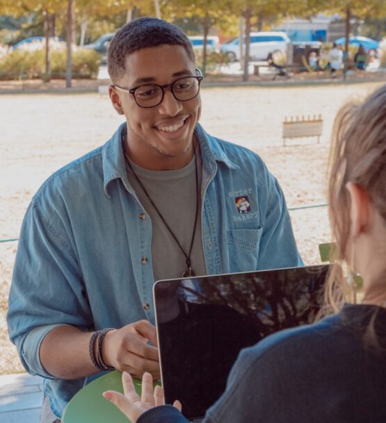 man wearing blue denim button-up shirt facing on human {{brizy_dc_image_alt imageSrc=